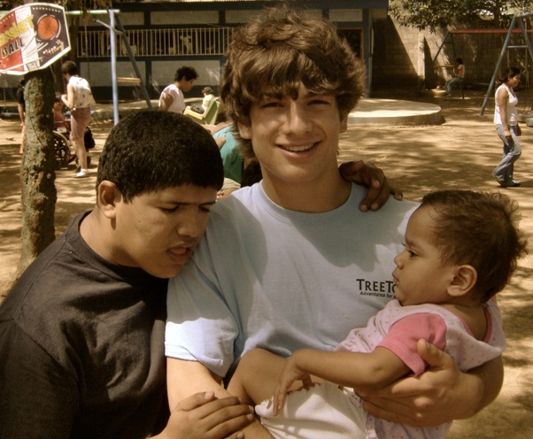 David Baker ’11 with children at Pajaritos Azul, a home for disabled children in Mangua, 2008
