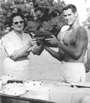 Mrs. Whittle holding cake with Robert Dean, 1963 winner.