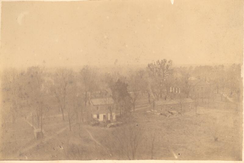 Davidson College as seen from above, depicting the old latticed well, a two story brick faculty house, Elm Row, and the Old Chapel