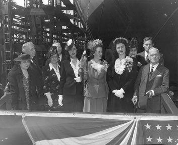 Christening the U.S.S. William Lee Davidson at Wilmington, NC. Mrs. Chalmers Davidson is holding the bottle. 