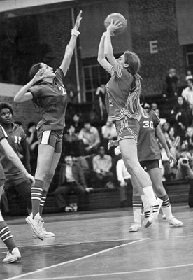 Donna Sherrill ’77 takes a shot over an opponent during the 1974-75 season.