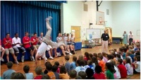 Landry Kosmalski entertains the children at Davidson Elementary, ‘10