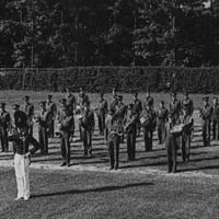 A picture of members of the first ROTC band at a parade rest