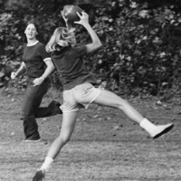 Two women playing the first female flickerball game in 1974.